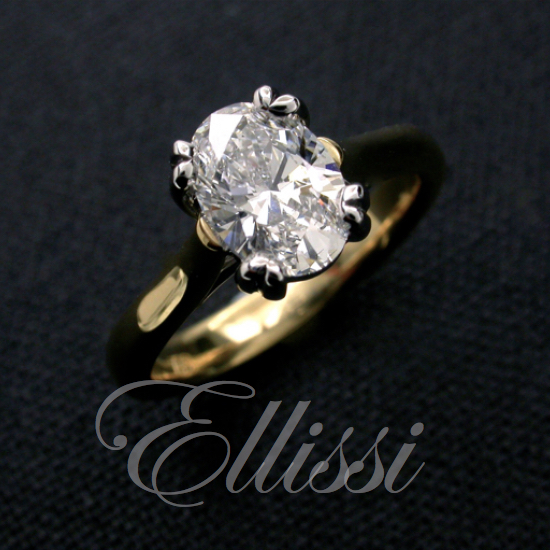 Two tone 18ct. yellow and white gold Solitaire