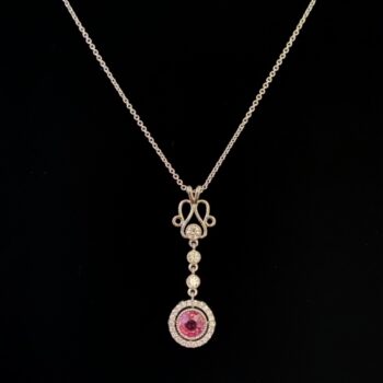 Art Nouveau inspired pendant set with a 2.03ct. round sapphire surrounded by diamonds